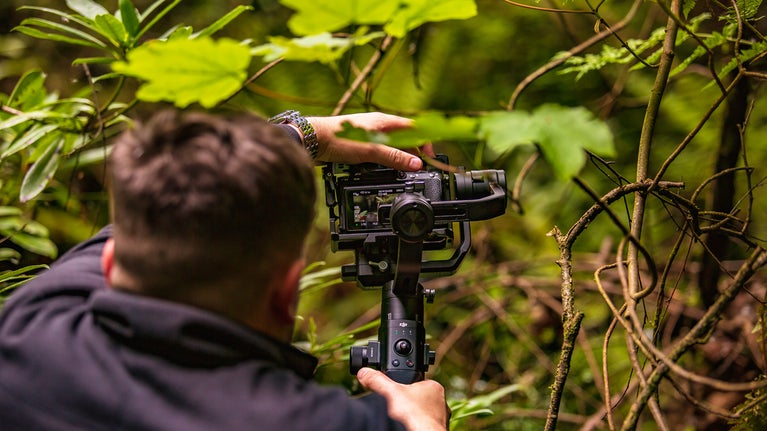Professional photographer filming at Brimham Rocks